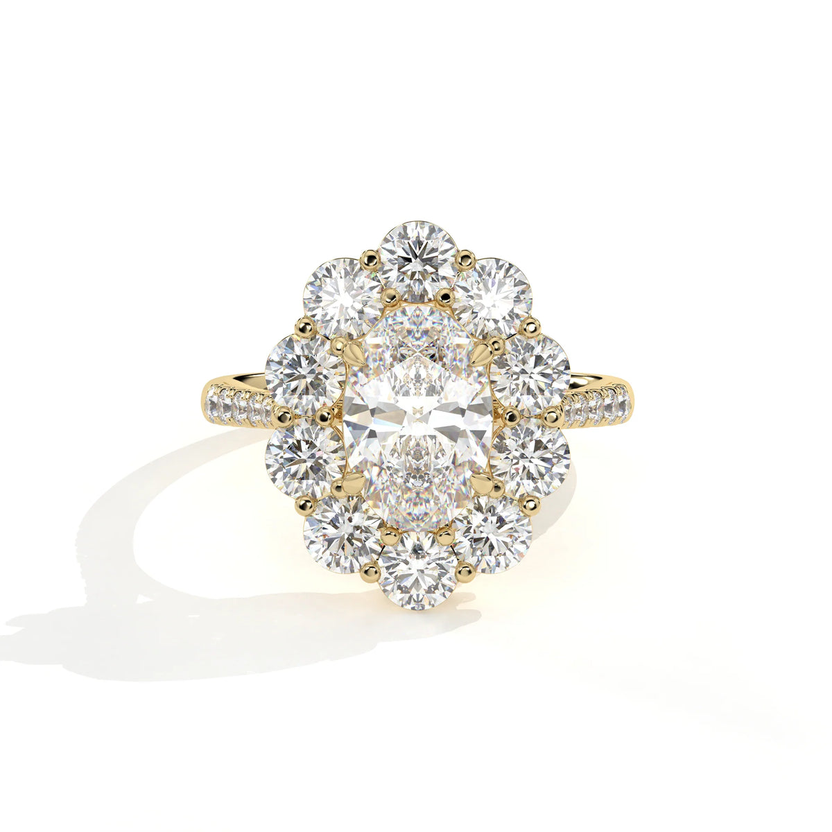 A yellow gold diamond ring with a large oval center stone surrounded by a halo of round diamonds, set on a plain white background with a soft shadow.