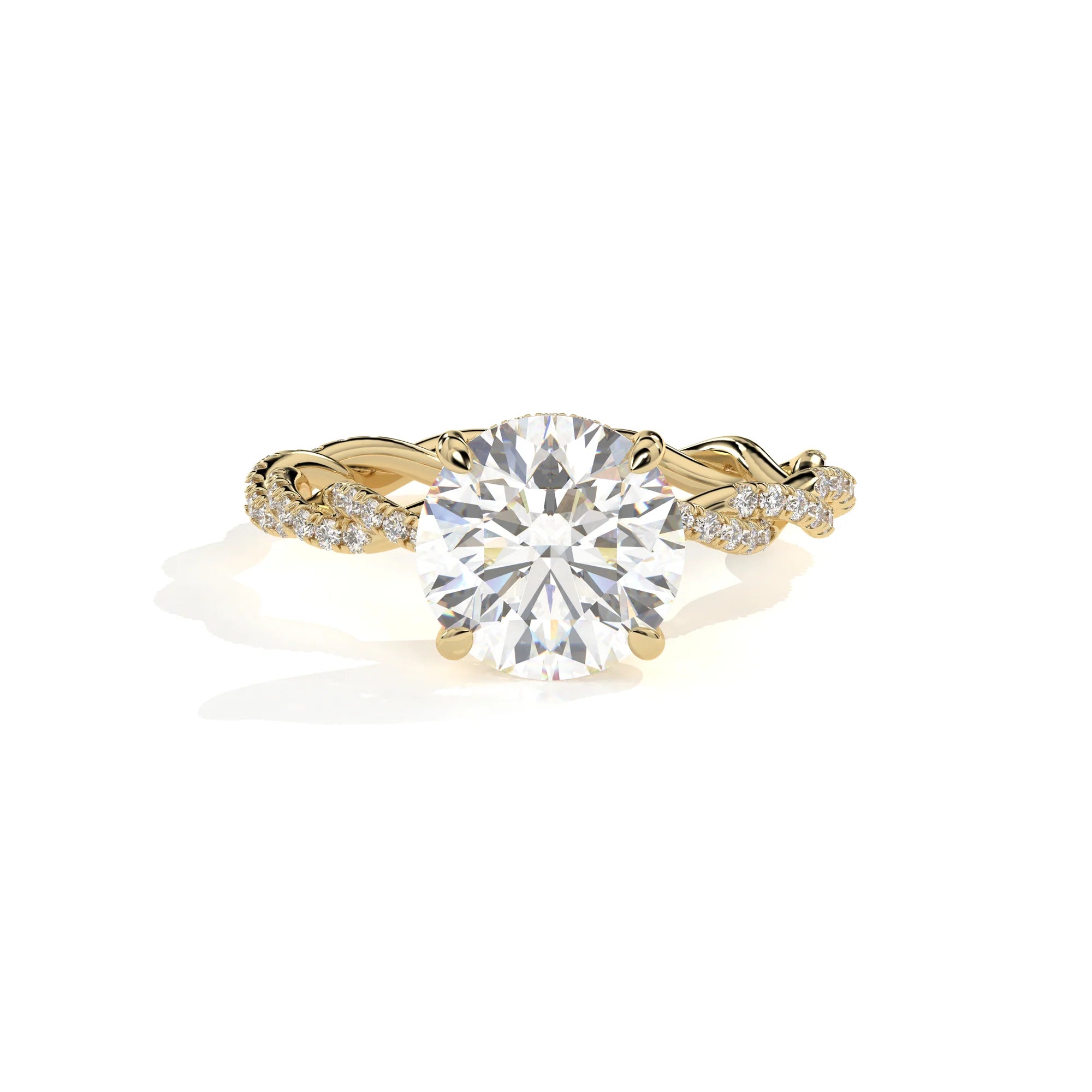 A yellow gold engagement ring featuring a large round brilliant-cut center stone and pavé-set accent stones along the twisted shank, shown on a clean white background.