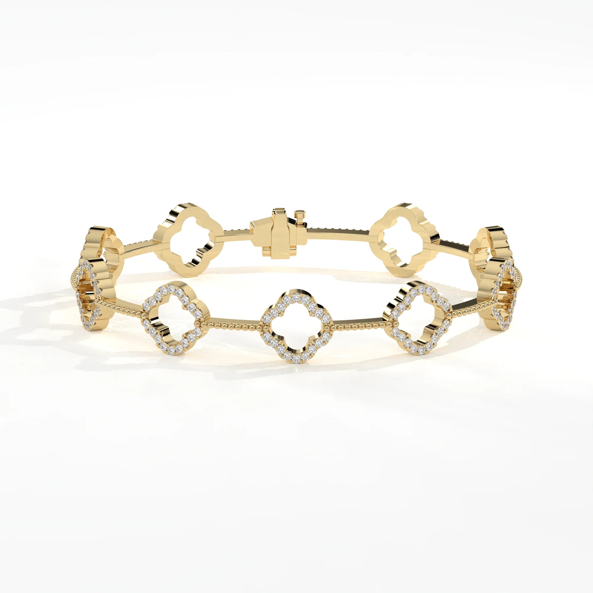 A gold bracelet featuring five interlocking quatrefoil links, adorned with small clear pavé diamonds, photographed on a clean white background.