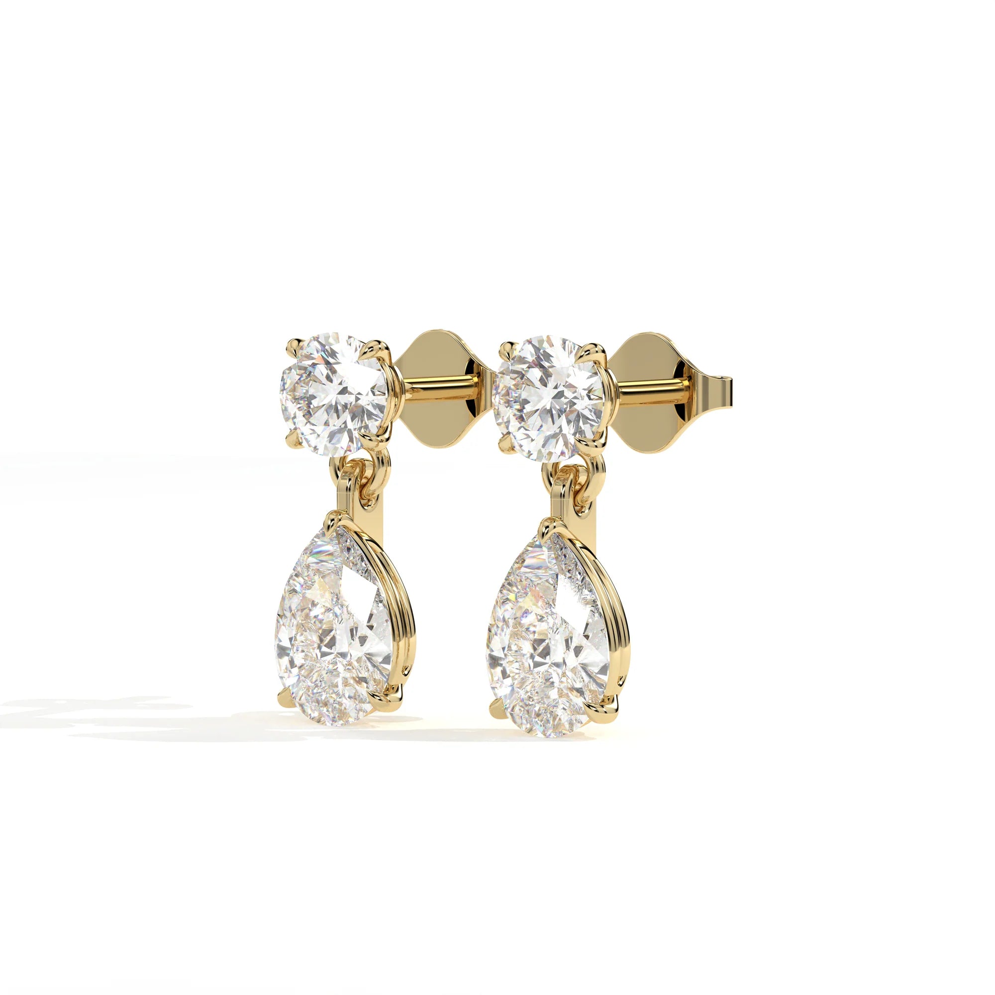 Gold earrings with clear gemstones on a white background