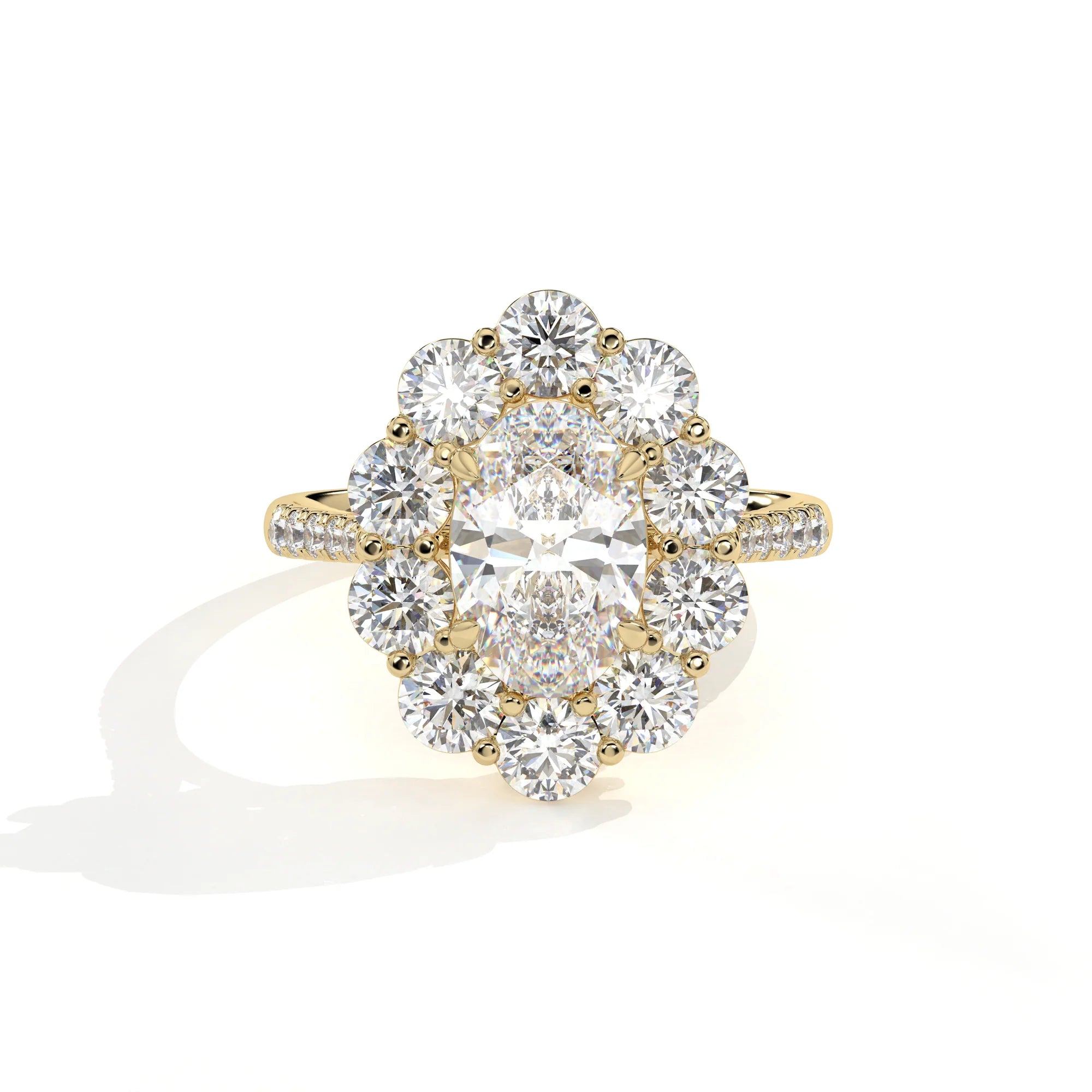 A yellow gold diamond ring with a large oval center stone surrounded by a halo of round diamonds, set on a plain white background with a soft shadow.