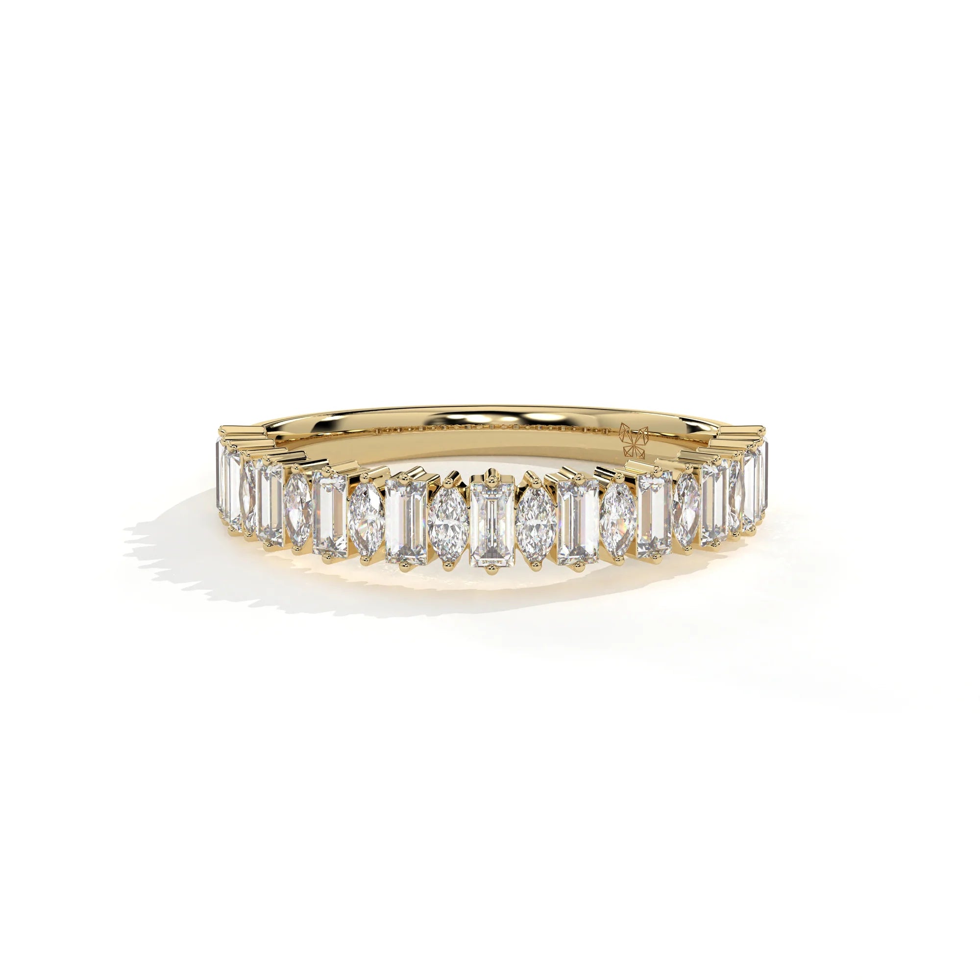 A yellow gold eternity ring featuring a row of baguette-cut clear diamonds, photographed on a clean white background with a soft shadow.